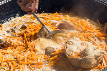 Cooking pilaf Uzbek nationalの写真素材