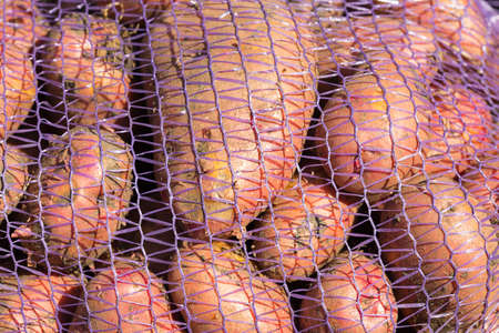 Red potatoes in a mesh bag