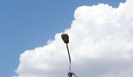 Detail of lamppost on cloudy sky backgroundの写真素材
