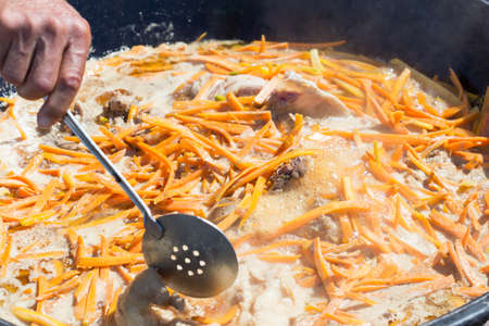 Cooking pilaf Uzbek nationalの写真素材