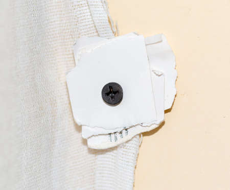 screw and wall paper
