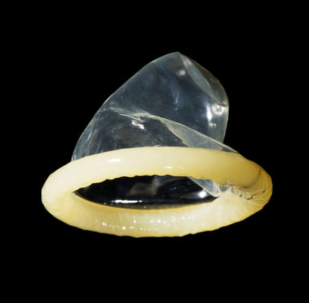 condom isolated on black backgroundの写真素材