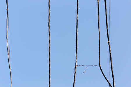 electrical wire against the bkue sky.の写真素材
