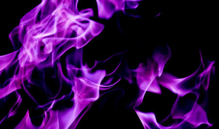 Purple fire flames on a black backgroundの写真素材