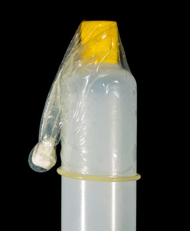condom isolated on black backgroundの写真素材