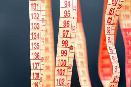 Meter for sewing on black macroの写真素材