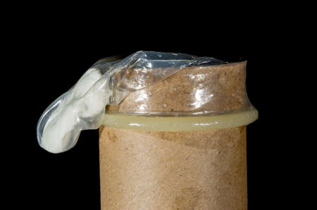 condom isolated on black backgroundの写真素材