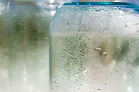 stylized glass jars under the sunの写真素材