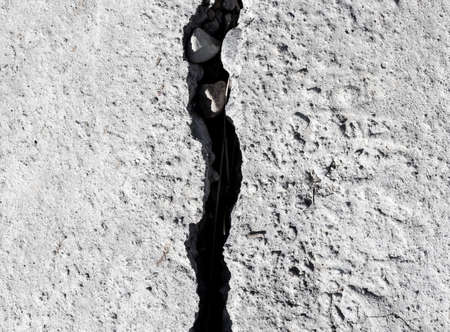 Cracked concrete texture closeup backgroundの写真素材