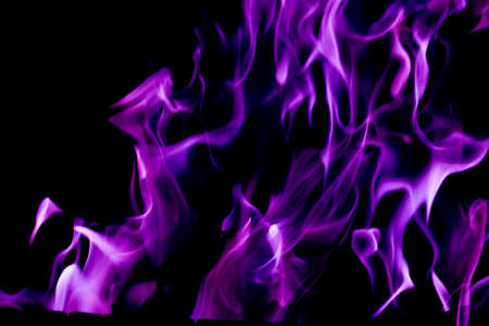 Purple fire flames on a black backgroundの写真素材