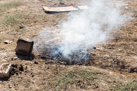 Smoke and fire from during Burning of garden wasteの写真素材