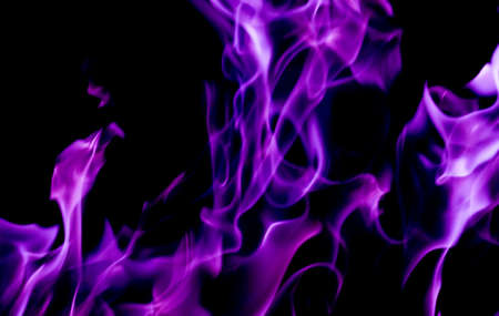 Purple fire flames on a black backgroundの写真素材