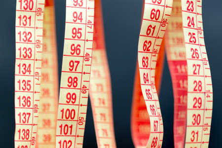 Meter for sewing on black macroの写真素材