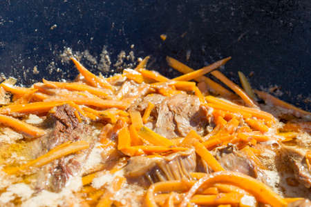 Cooking pilaf Uzbek nationalの写真素材