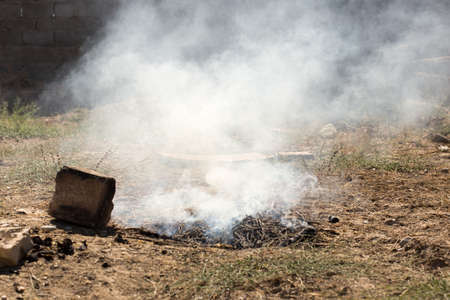 Smoke and fire from during Burning of garden wasteの写真素材
