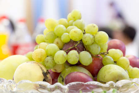 grapes, fruit on the vase on the tableの写真素材