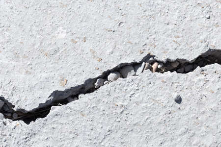 Cracked concrete texture closeup backgroundの写真素材