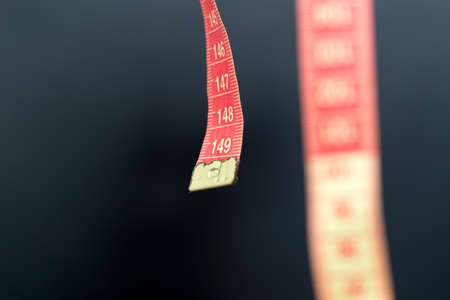 Meter for sewing on black macroの写真素材