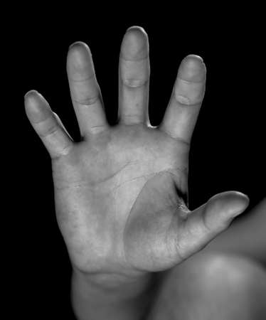 Hand on a black background