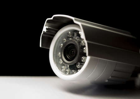 Surveillance cameras for sale photographed on a black background
