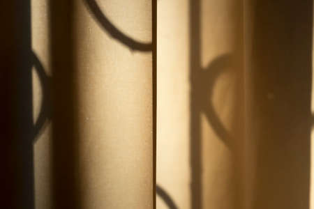 Beautiful view on sunset from home window curtains