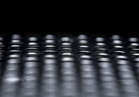 Background steel plate with round holesの写真素材