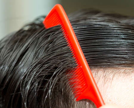 man combing hairの写真素材