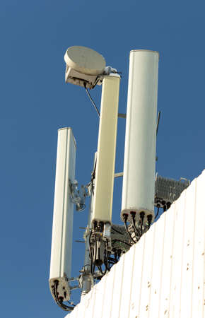 Cellular antenna on the roof of the buildingの写真素材