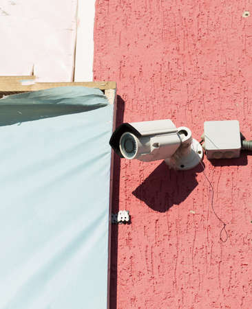 Surveillance camera attached to the outside wallの写真素材