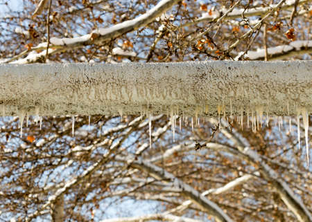 ice icicles on the tubeの写真素材