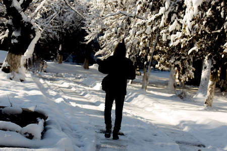 man walks in the snow