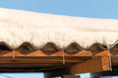 Snow on the roof of asbestosの写真素材