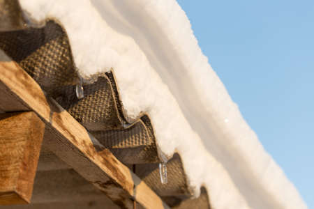 Snow on the roof of asbestosの写真素材