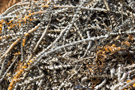 silver spirals of metal shavings as garbage, texture of different size of metal spirals shavings texture, metal shavings textureの写真素材