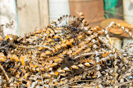 silver spirals of metal shavings as garbage, texture of different size of metal spirals shavings texture, metal shavings textureの写真素材