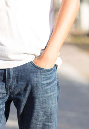 male hand in the pocket of jeansの写真素材