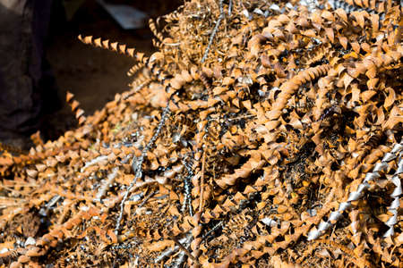 silver spirals of metal shavings as garbage, texture of different size of metal spirals shavings texture, metal shavings textureの写真素材