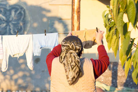 Woman hangs thingsの写真素材