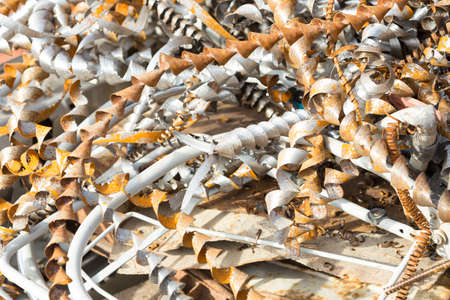 silver spirals of metal shavings as garbage, texture of different size of metal spirals shavings texture, metal shavings textureの写真素材