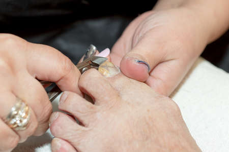 Pedicure in salon. The process of cleaning the feetの写真素材