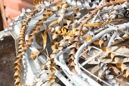silver spirals of metal shavings as garbage, texture of different size of metal spirals shavings texture, metal shavings textureの写真素材