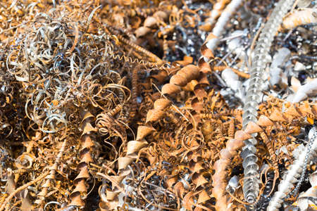 silver spirals of metal shavings as garbage, texture of different size of metal spirals shavings texture, metal shavings textureの写真素材