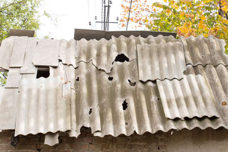 Damaged asbestos roofing materialの写真素材