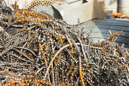 silver spirals of metal shavings as garbage, texture of different size of metal spirals shavings texture, metal shavings textureの写真素材