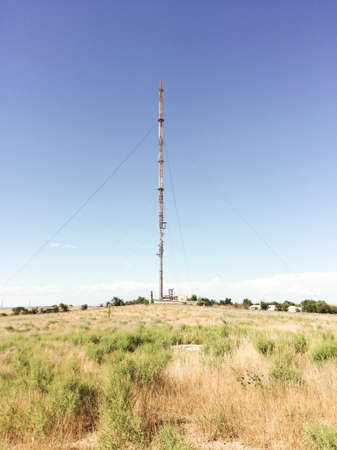 Communication tower on a blue sky background