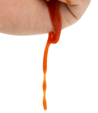 Hand smeared with ketchup dripping from handsの写真素材