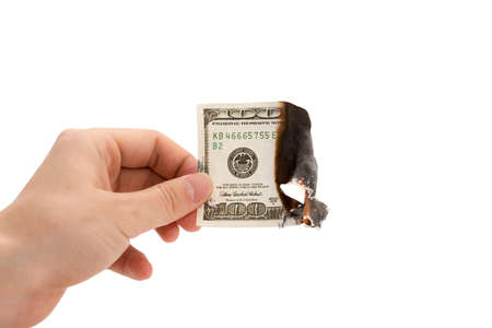 fire dollar on a white backgroundの写真素材