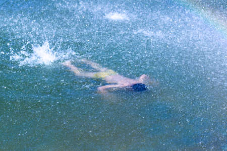 Children bathe in the pool of the cityの写真素材