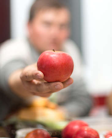 Man takes appleの写真素材