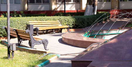 Wooden bench in the city parkの写真素材